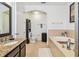 This well lit bathroom features granite countertops, a soaking tub and toilet closet at 6412 Mayra Shores Ln, Apollo Beach, FL 33572