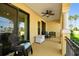 Inviting covered patio provides scenic views and comfortable outdoor seating arrangement at 6412 Mayra Shores Ln, Apollo Beach, FL 33572