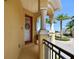 Inviting porch with classic columns and a red front door with a decorative wreath at 6412 Mayra Shores Ln, Apollo Beach, FL 33572