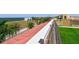 Expansive rooftop view showcasing red tile roofing with views of lush landscaping and the bay at 6412 Mayra Shores Ln, Apollo Beach, FL 33572