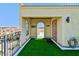 Inviting rooftop deck featuring synthetic grass and doorway access, great for outdoor relaxation and entertaining at 6412 Mayra Shores Ln, Apollo Beach, FL 33572