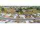 Aerial view of a single-story home with a golf course in the background at 646 Allegheny Dr, Sun City Center, FL 33573