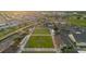 Aerial view showcases the planned community with lawn bowling area, club house and ample parking space at 646 Allegheny Dr, Sun City Center, FL 33573