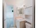 Bathroom with a view to the bedroom, featuring vanity, sink, and updated fixtures at 646 Allegheny Dr, Sun City Center, FL 33573