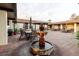 Courtyard features a fountain surrounded by tables and chairs for relaxation at 646 Allegheny Dr, Sun City Center, FL 33573