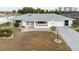 Charming single-story home featuring a well-maintained yard, neutral tones, and attached two-car garage at 646 Allegheny Dr, Sun City Center, FL 33573