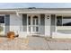 Close-up of front entrance featuring neutral-toned decor, a decorative door, and meticulous landscaping at 646 Allegheny Dr, Sun City Center, FL 33573