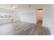 Inviting living area featuring gray wood-look floors and lots of natural light at 646 Allegheny Dr, Sun City Center, FL 33573