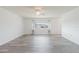Bright and airy living room with a ceiling fan, large window, and stylish light wood flooring at 646 Allegheny Dr, Sun City Center, FL 33573
