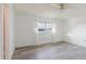 Light-filled main bedroom with wood-look floors, a ceiling fan, and neutral decor at 646 Allegheny Dr, Sun City Center, FL 33573