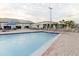 Outdoor pool with many lounge chairs and tables at 646 Allegheny Dr, Sun City Center, FL 33573