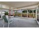 Bright sunroom features windows offering expansive views of the surrounding area and comfortable seating at 646 Allegheny Dr, Sun City Center, FL 33573