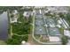 Aerial view of multiple tennis courts and surrounding foliage at 646 Allegheny Dr, Sun City Center, FL 33573