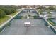 Aerial view of well-maintained tennis courts with green surroundings at 646 Allegheny Dr, Sun City Center, FL 33573
