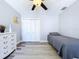 Serene bedroom with ceiling fan and closet space at 6811 S Himes Ave, Tampa, FL 33611