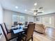 The dining area is situated adjacent to the front doors and a large sectional couch at 6811 S Himes Ave, Tampa, FL 33611