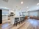 Open concept kitchen with granite counters, stainless appliances, and breakfast bar at 6811 S Himes Ave, Tampa, FL 33611
