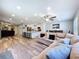 A wide angle view of the open concept living, dining and kitchen area with natural light at 6811 S Himes Ave, Tampa, FL 33611