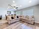 The living room showcases a sectional couch with a view into the adjacent dining area at 6811 S Himes Ave, Tampa, FL 33611