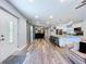 An open-concept design leads from the front door to the living area, island and kitchen at 6811 S Himes Ave, Tampa, FL 33611