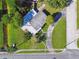 Aerial view of property showcasing the home's layout, expansive lot, and circular driveway at 7000 14Th N St, St Petersburg, FL 33702
