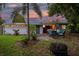 Spacious backyard with a patio, outdoor seating, and a fire pit, ideal for gatherings at 7000 14Th N St, St Petersburg, FL 33702