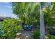 Cozy backyard patio with a brick surface and beautiful landscaping provides a relaxing outdoor space at 7000 14Th N St, St Petersburg, FL 33702