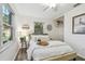 Cozy bedroom with modern decor, hardwood floors, and plenty of natural light at 7000 14Th N St, St Petersburg, FL 33702