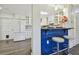 Open kitchen layout with a breakfast bar, white cabinets, and modern appliances at 7000 14Th N St, St Petersburg, FL 33702
