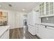 Spacious kitchen with sleek appliances, ample counter space, and access to other rooms at 7000 14Th N St, St Petersburg, FL 33702