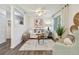 Cozy living room featuring neutral decor, hardwood floors, and bright natural light from large windows at 7000 14Th N St, St Petersburg, FL 33702