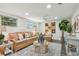 Bright and airy living room featuring neutral tones, modern decor, and hardwood floors at 7000 14Th N St, St Petersburg, FL 33702