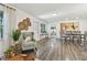 Inviting living space with hardwood flooring, neutral walls, and abundant natural light at 7000 14Th N St, St Petersburg, FL 33702