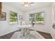 Bright office space with a ceiling fan, a large window, and comfortable furniture at 7000 14Th N St, St Petersburg, FL 33702