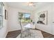 Bright home office features a modern white desk, stylish chair, and views of the outdoors at 7000 14Th N St, St Petersburg, FL 33702