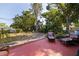 Spacious backyard featuring a vibrant patio area with seating, lush greenery, and a serene outdoor setting at 725 85Th N Ave, St Petersburg, FL 33702