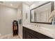 Bathroom boasts a marble vanity, modern fixtures, and well-lit space with decorative artwork at 725 85Th N Ave, St Petersburg, FL 33702