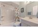 Charming bathroom with shower-tub combo, modern vanity, and stylish fixtures at 725 85Th N Ave, St Petersburg, FL 33702