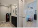 Stylish bathroom with sleek vanity, modern fixtures, and seamless flow to the primary bedroom at 725 85Th N Ave, St Petersburg, FL 33702