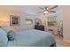 Inviting bedroom features comfortable bed, decorative accents, lots of light, and ample closet space at 725 85Th N Ave, St Petersburg, FL 33702