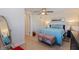 Serene bedroom features comfortable bed, ample natural light, and views to ensuite bath at 725 85Th N Ave, St Petersburg, FL 33702
