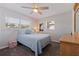Comfortable bedroom showcasing a bed, dresser, and natural light from the window at 725 85Th N Ave, St Petersburg, FL 33702