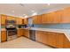 This kitchen features modern stainless steel appliances, white countertops, and wood-colored cabinets at 725 85Th N Ave, St Petersburg, FL 33702