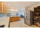 Featuring modern, stainless steel appliances, the kitchen opens into a living space at 725 85Th N Ave, St Petersburg, FL 33702
