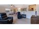 Spacious living room with ample seating, warm lighting, and seamless flow to other areas at 725 85Th N Ave, St Petersburg, FL 33702