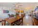 Featuring Terrazzo flooring, a white brick wall and views into other living spaces, this room feels expansive at 725 85Th N Ave, St Petersburg, FL 33702