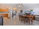 This room features terrazzo flooring, a ceiling fan, and plenty of natural light from the windows at 725 85Th N Ave, St Petersburg, FL 33702