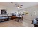 Bright living space with Terrazzo flooring, a decorative light fixture, and an oval entry door at 725 85Th N Ave, St Petersburg, FL 33702