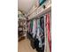 Organized walk-in closet with shelving, hanging rods, and ample storage space for clothes and accessories at 725 85Th N Ave, St Petersburg, FL 33702