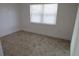Bedroom featuring tile flooring, and a window allowing for natural light at 7534 Mako Dr, Hudson, FL 34667